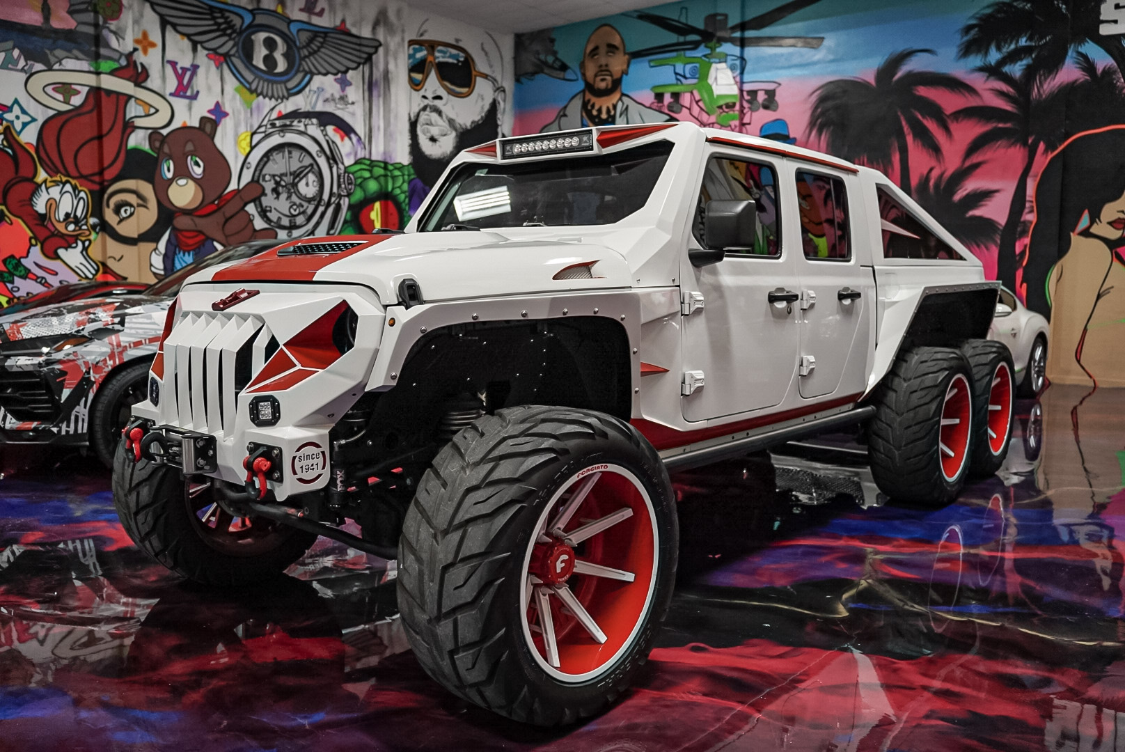 Custom automotive build workspace at Showroom Miami showcasing precision craftsmanship and bespoke modifications